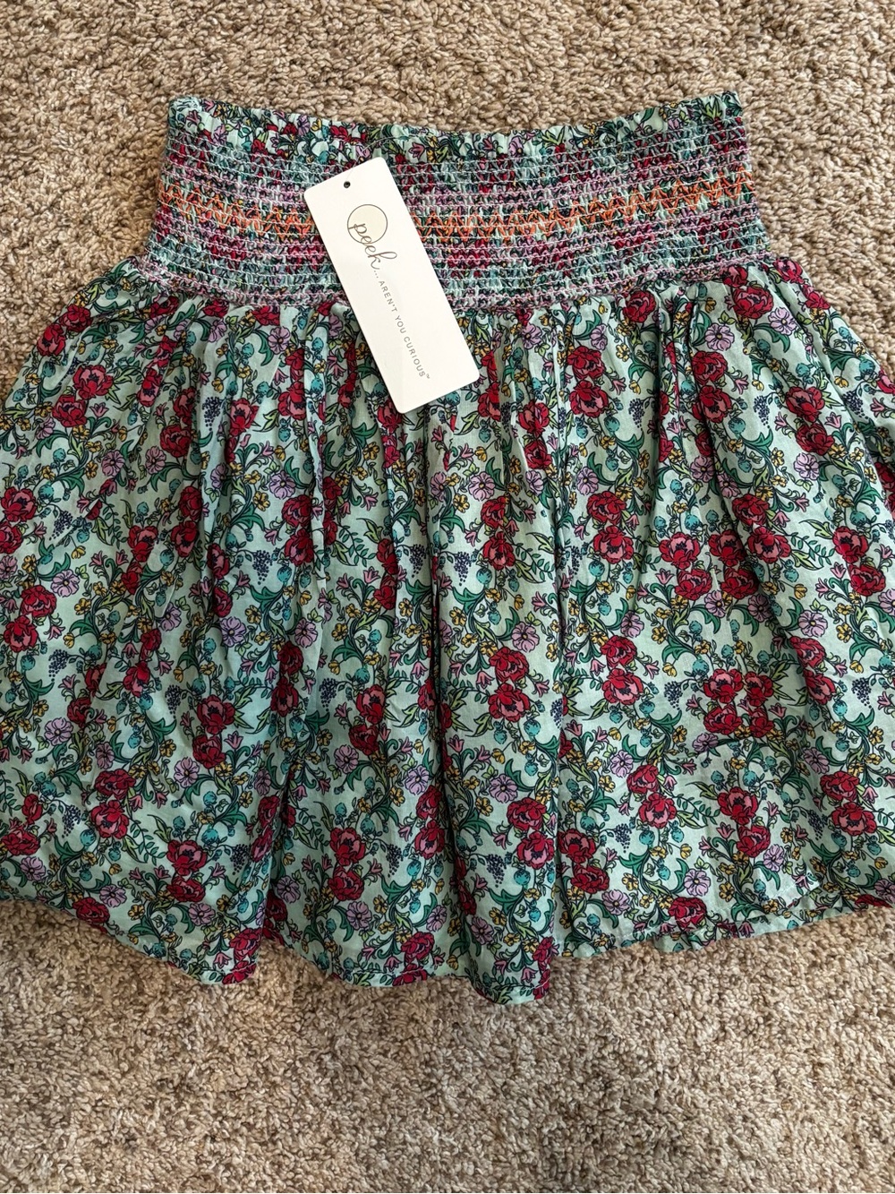 NWT!! PEEK AREN’T YOU CURIOUS Pixie Smocked Tiered skirt. Size 6/7.